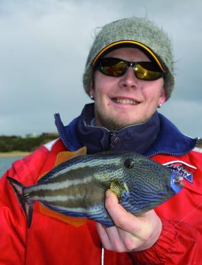 Morne Muller is all smiles because he knows just how good this six-spined leatherjacket is going to taste.